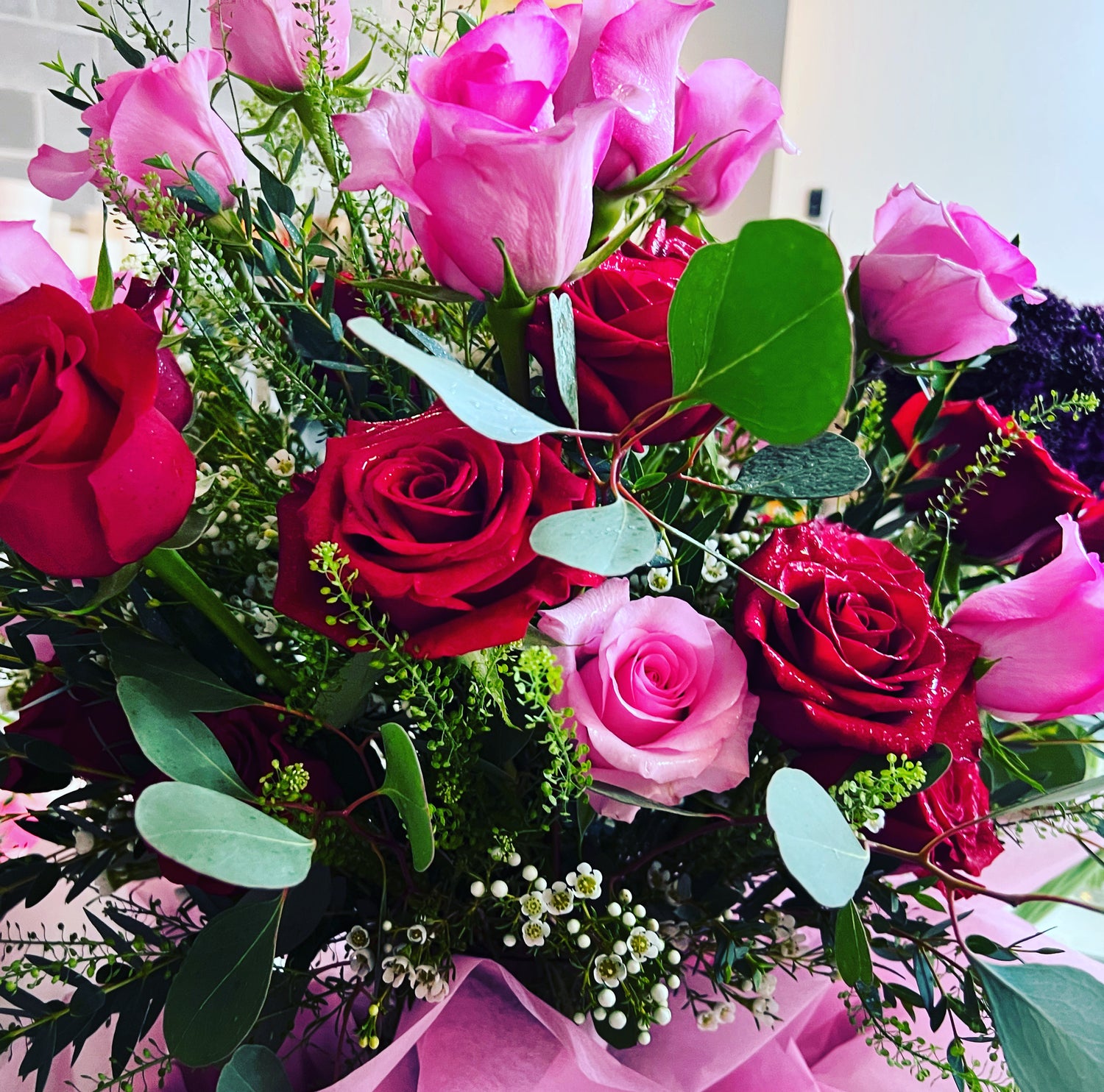 Spectacular flower arrangement for loved one.  Mt Pleasant luxury florals. Bright pink and red flowers.